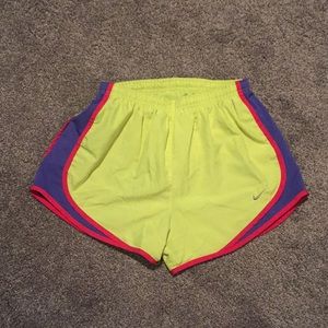 Yellow Nike running shorts
